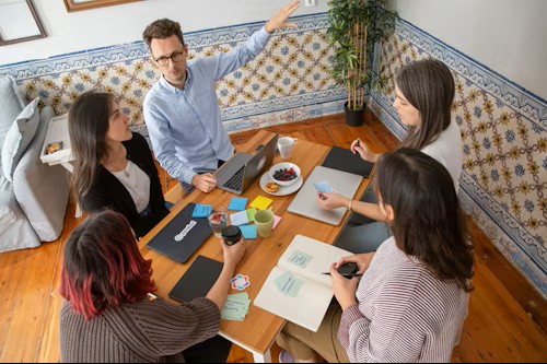 Team at work around a small conference table.